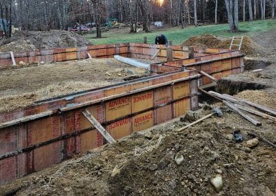 Excavation and foundation preparation for a new residential construction project by A Bailey Asphalt in the Concord, NH area.