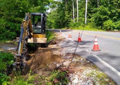 A Bailey Asphalt excavator performing roadside excavation in the Concord, NH area.