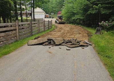 A Bailey Asphalt crew preparing a residential driveway for new asphalt installation in the Concord, NH area.