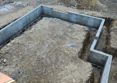 Foundation excavation and site preparation for residential construction in the Concord, NH area.